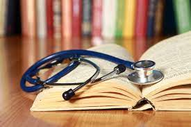 Stethoscope placed on top of books