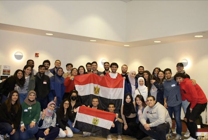 Students posing for a photo with the Egyptian flag