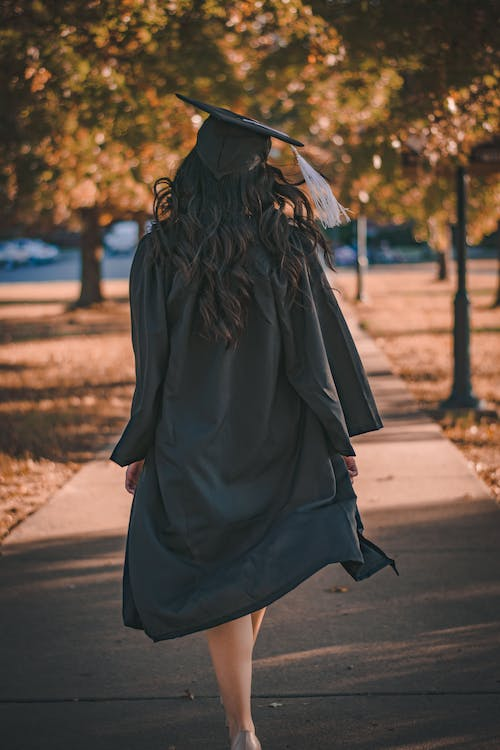 a girl wearing her graduation cap and gown