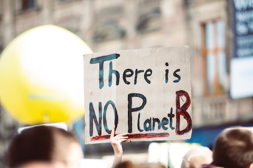 a climate protest sign reading 